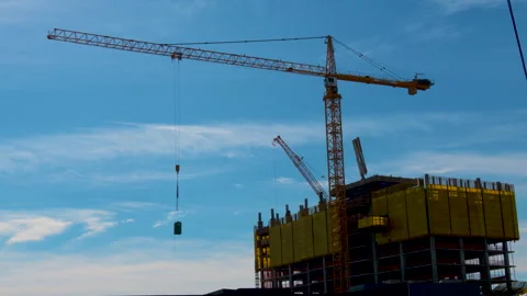 Two Cranes Moving at a Construction Site Stock Footage 240524428