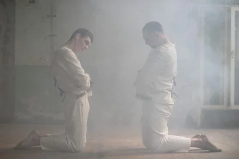 Two crazy men in straitjackets are in an abandoned clinic Stock Photos
