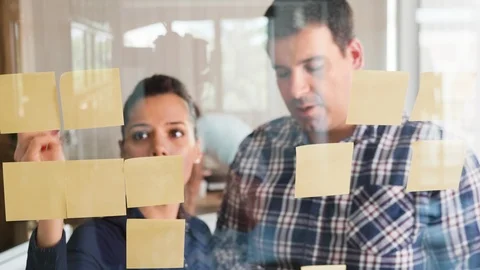 Two creative coworkers having a good communitcation while working together on a Stock Footage 113914754