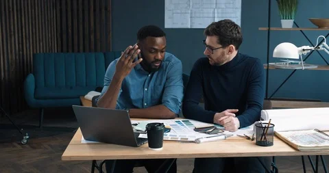 Two creative Designers sitting in modern Studio-Office, choosing Colors.Two Stock Footage 126234551