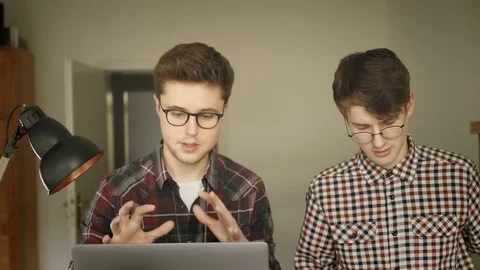 Two creative people are discussing a new project Stock Footage 82051189