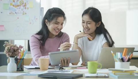 Two creative people working on new project together at office.. Stock Photos