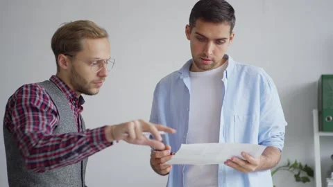 Two creative web designers discussing ideas Stock Footage 142527842