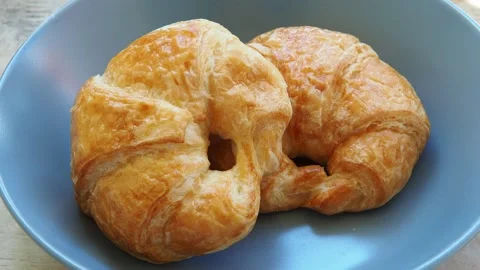 Two Croissant bread placed on a ceramic plate Stock Footage 167803916