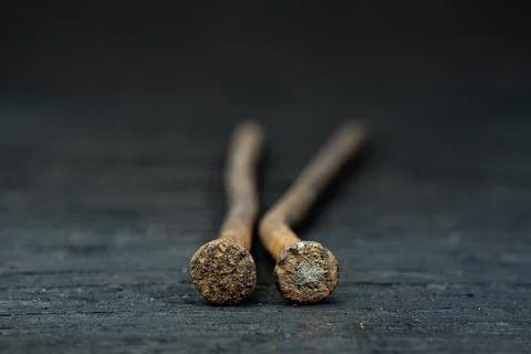 Two croocked rusty nails on the ebony Stock Photos