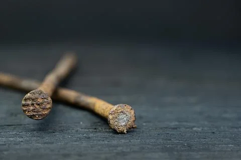 Two croocked rusty nails on the ebony Stock Photos