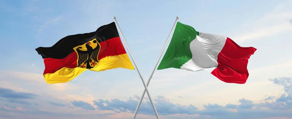 Two crossed flags Germany and Italy waving in wind at cloudy sky. Concept of  Stock Illustration