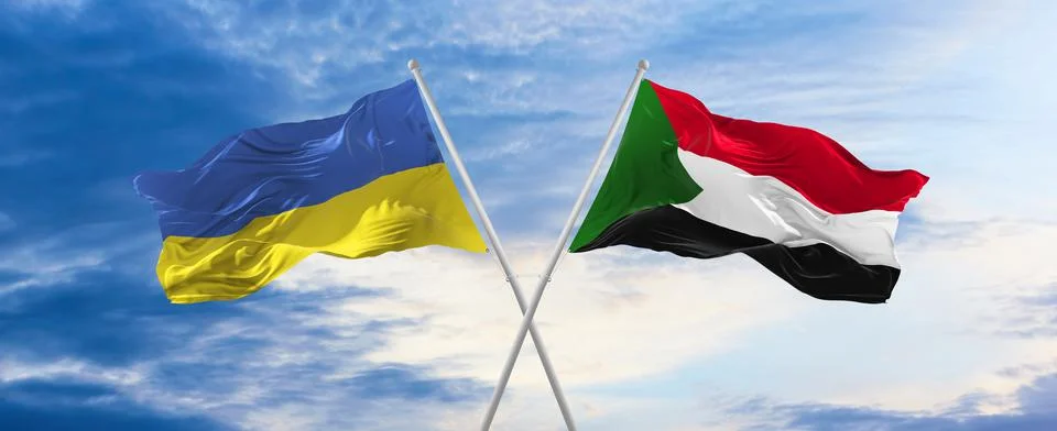Two crossed flags Sudan and Ukraine waving in wind at cloudy sky. Concept of  Stock Illustration