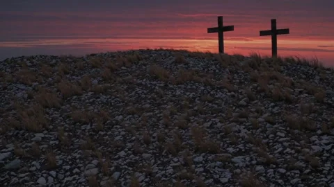 Two Crosses on a Hilltop Overlooking Rolling Countryside at Sunrise Stock Footage 307169932