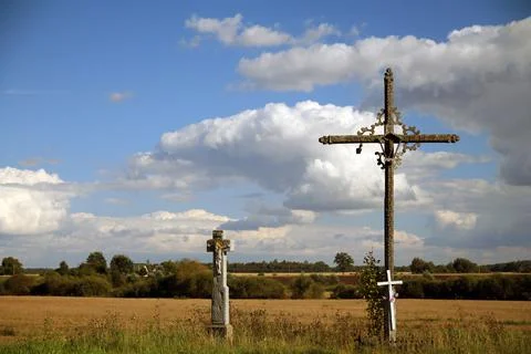 The two crosses in the prairie with the clouds Stock Photos