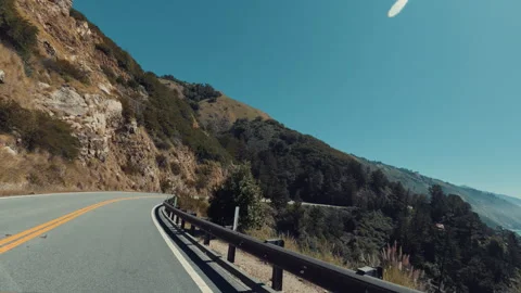 Two Crows Flying Over The Car On Pacific Coast Highway 1, Big Sur Area Stock Footage 345856795