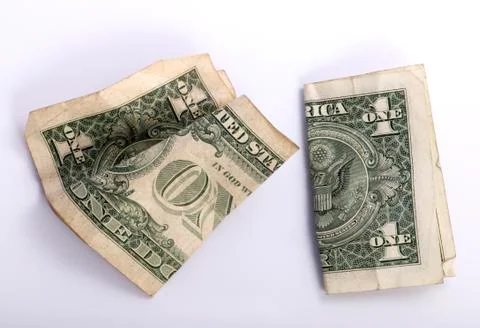 Two crumpled one dollar banknotes Stock Photos