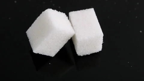 Two Cubes Of Sugar On The Black Background Stock Footage 169934706