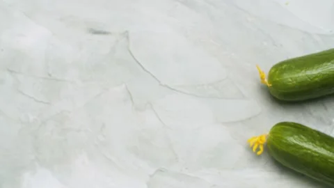 Two cucumbers - vegetable background Stock Footage 140343529