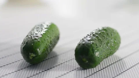 Two cucumbers on a white table Stock Footage 124190502