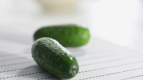 Two cucumbers on a white table. Stock Footage 124190521