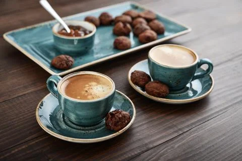 Two cup of coffee and with chocolate cookies Stock Photos