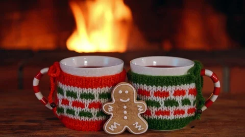 Two cup of hot tea or coffe with christmas decoration at romantic fireplace Stock Footage 99081583