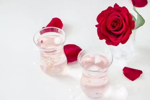 Two cup Refreshing Rose water lemonade with ice cubes and Rose flower glass Stock Photos