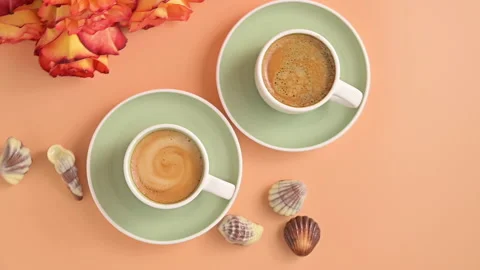 Two cups of aromatic espresso coffee with froth. Traditionony is an Italian Stock Footage 148726049