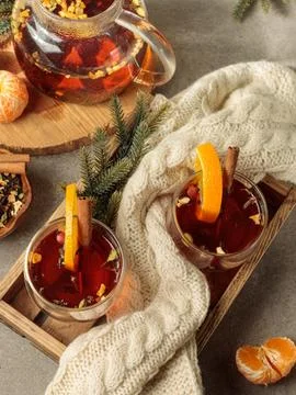 Two cups of aromatic tea with spices and orange or two glasses of hot mulled 库存照片