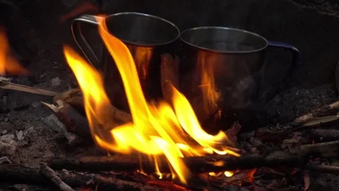 Two cups in bonfire Stock Footage 77488635
