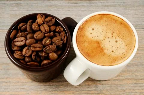 Two cups of coffee and beans Stock Photos