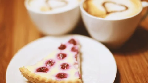 Two cups of coffee and a piece of birthday cake Stock Footage 104144431