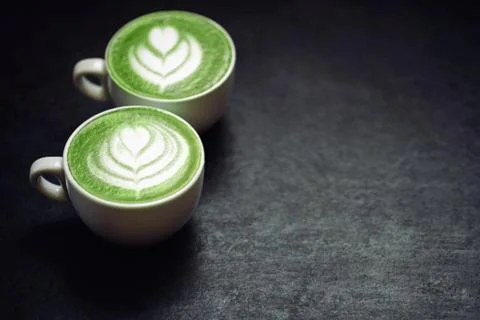 Two cups of coffee on black rustic background Stock Photos