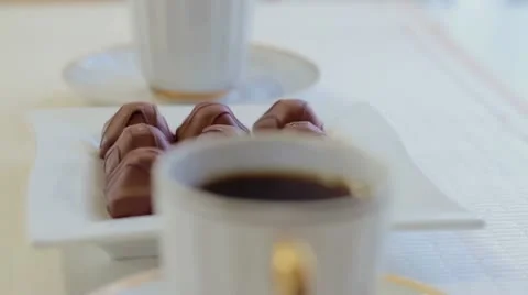 Two cups of coffee with candies Stock Footage 22319038