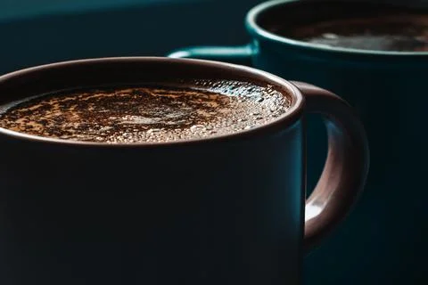 Two cups of coffee close-up, in dim light Stock Photos