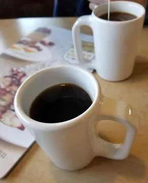 Two Cups of Coffee at Diner Table Stockfoto's