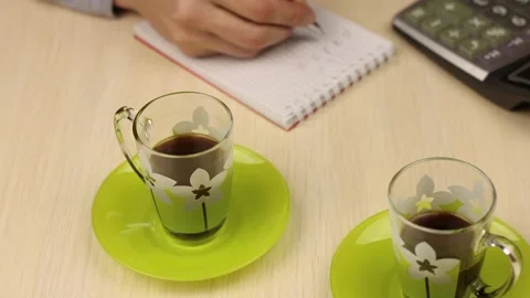 Two cups of coffee in the foreground. Business conversation. Vidéo 150236213