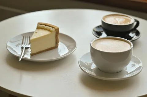 Two cups of coffee latte with cake Stock Photos