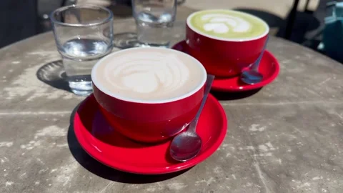 Two cups of coffee served on a cafe table. Stock Footage 320585582