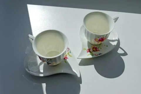 Two cups for coffee in the sun Stock Photos