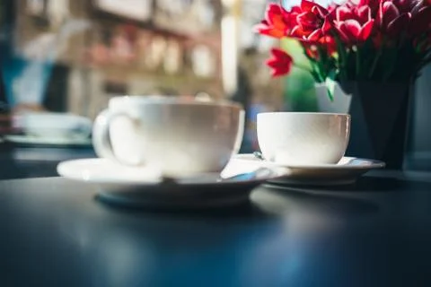 Two cups of coffee on table in cafe Stock Photos