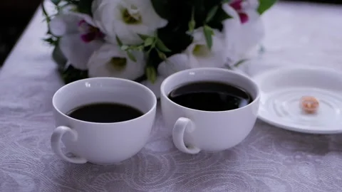 Two cups of coffee on a wooden table indoors. Stock Footage 124037346