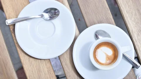 Two cups of espresso with milk foam. Meeting in a cafe for two and fragrant Video stock 131696812