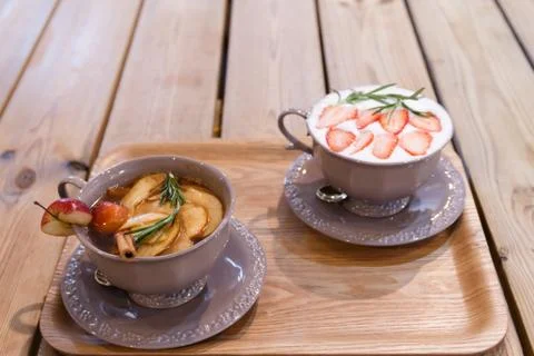 Two cups of fruits tea on the table Stock Photos