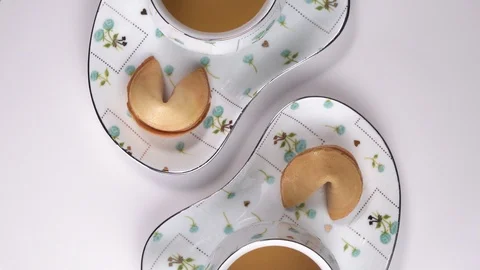 Two Cups with green tea rotating on white table. Tea cup top down view in nice Stock Footage 124420619