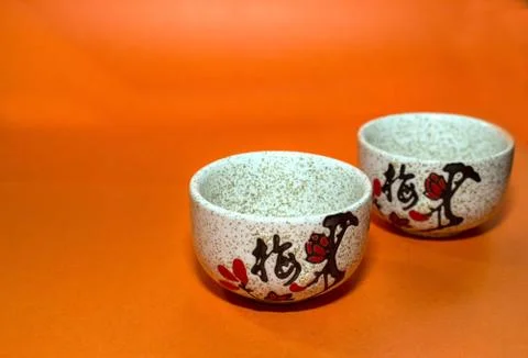 Two cups with a hieroglyph Stock Photos