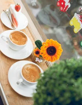 Two cups of hot coffee placed on the table in a caf. Stock Photos