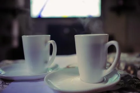 Two cups of hot coffee on the table in a calm and comfortable atmosphere Stock Photos
