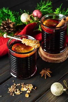 Two cups of hot mulled wine on a dark wooden background Stock Photos