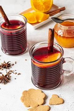Two cups of hot mulled wine on a grey background Stock Photos