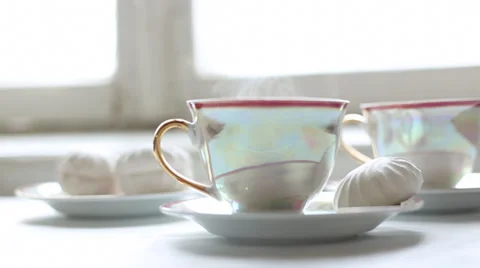 Two cups of hot tea and dessert on the table Stock Footage 38039349