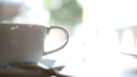 Two cups of invigorating coffee on the table with a piece of sweet tasty cake Stock Footage 96610891