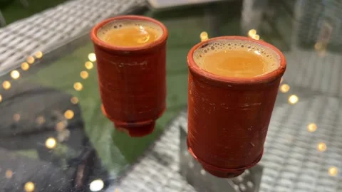 Two cups of Kulhad tea served in a restaurant in India Stock Footage 312426477