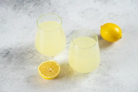 Two cups of lemonade with lemon slices Stock Photos